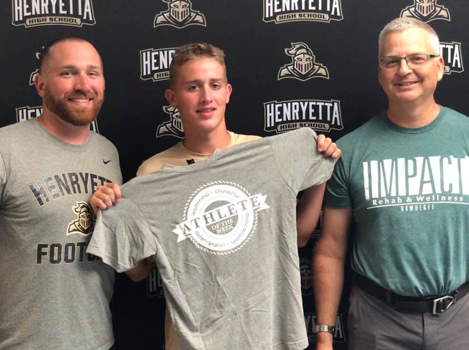 Picture of Impact Athlete of the Week, Jakob White, with the head football coach at Henryetta and Michael Siegenthaler.