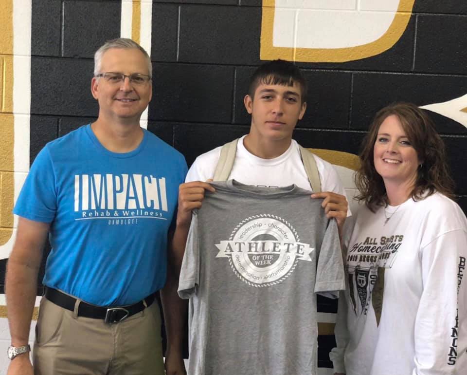 Impact Athlete of the Week winner, Jesse Pendergrass, pictured with the Beggs High School Prinicpal and Michael Siegenthaler.