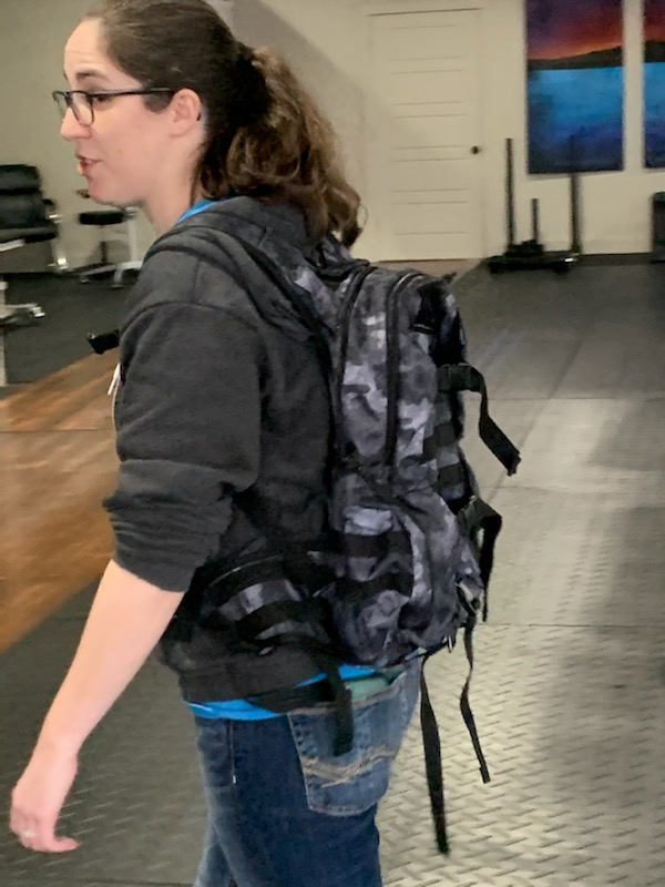 Lacie, trying on her new rucksack with 20lbs inside. You can tell by her face that reality is sinking in that it's more difficult than she expected.