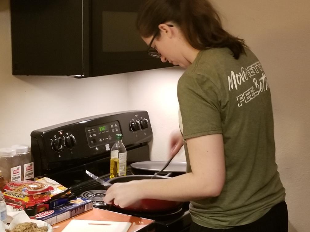 Lacie cooking her veggies.