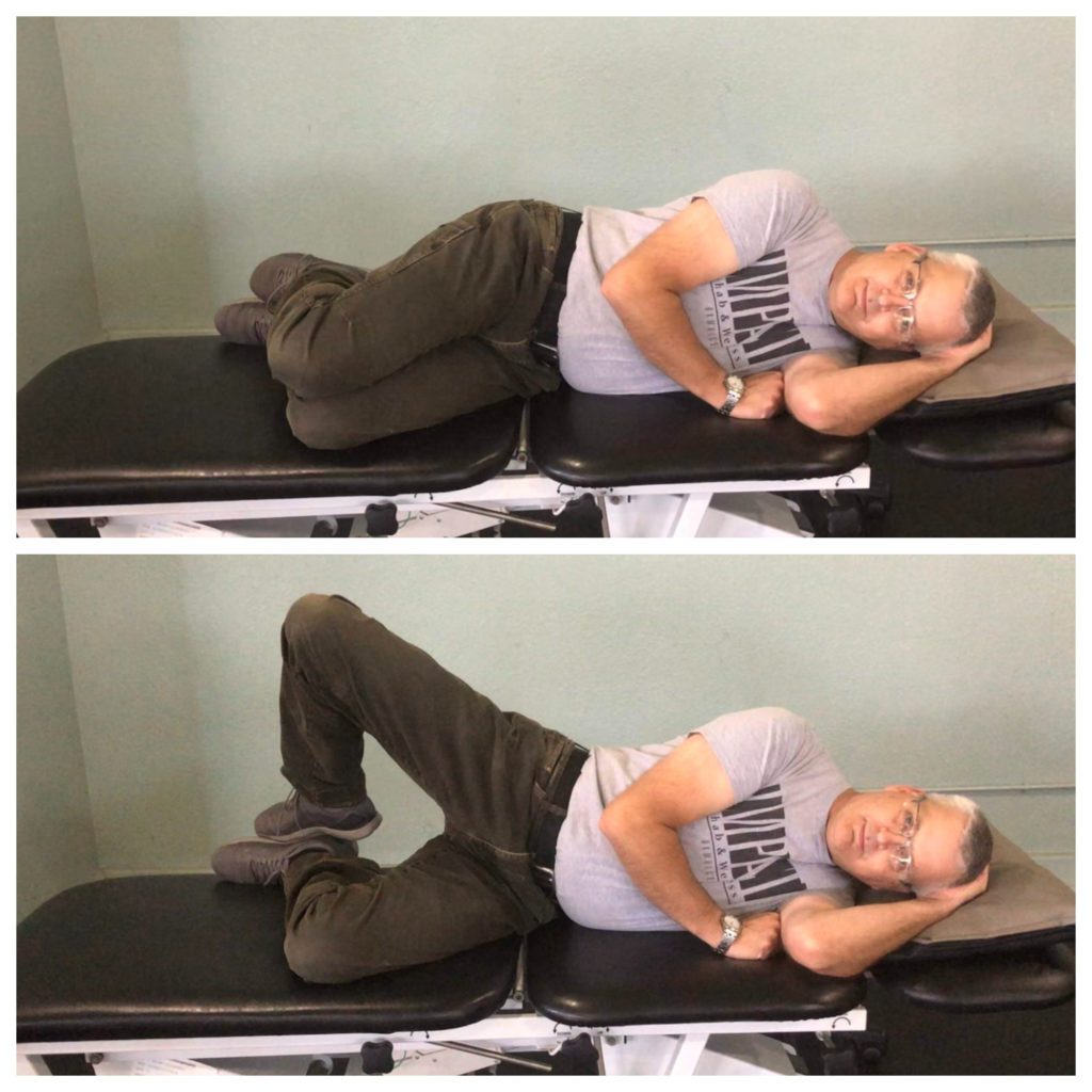 Michael demonstrating clam shell exercise to strengthen hips.