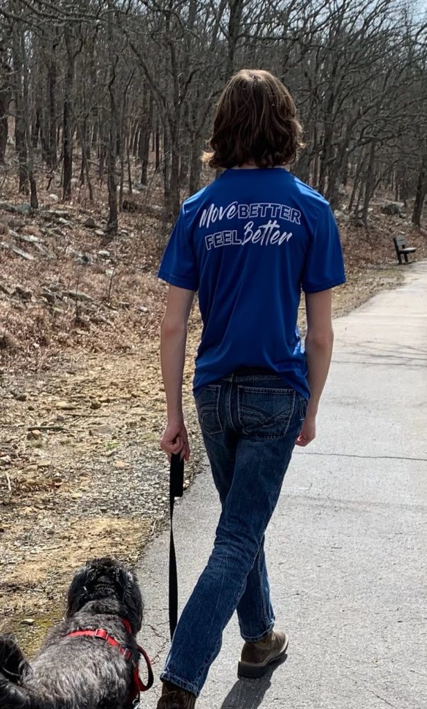 Jackson exercises by taking a walk with his dog, Rocky.